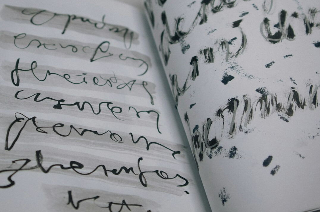 Handwritten notes and a pen on an open notebook