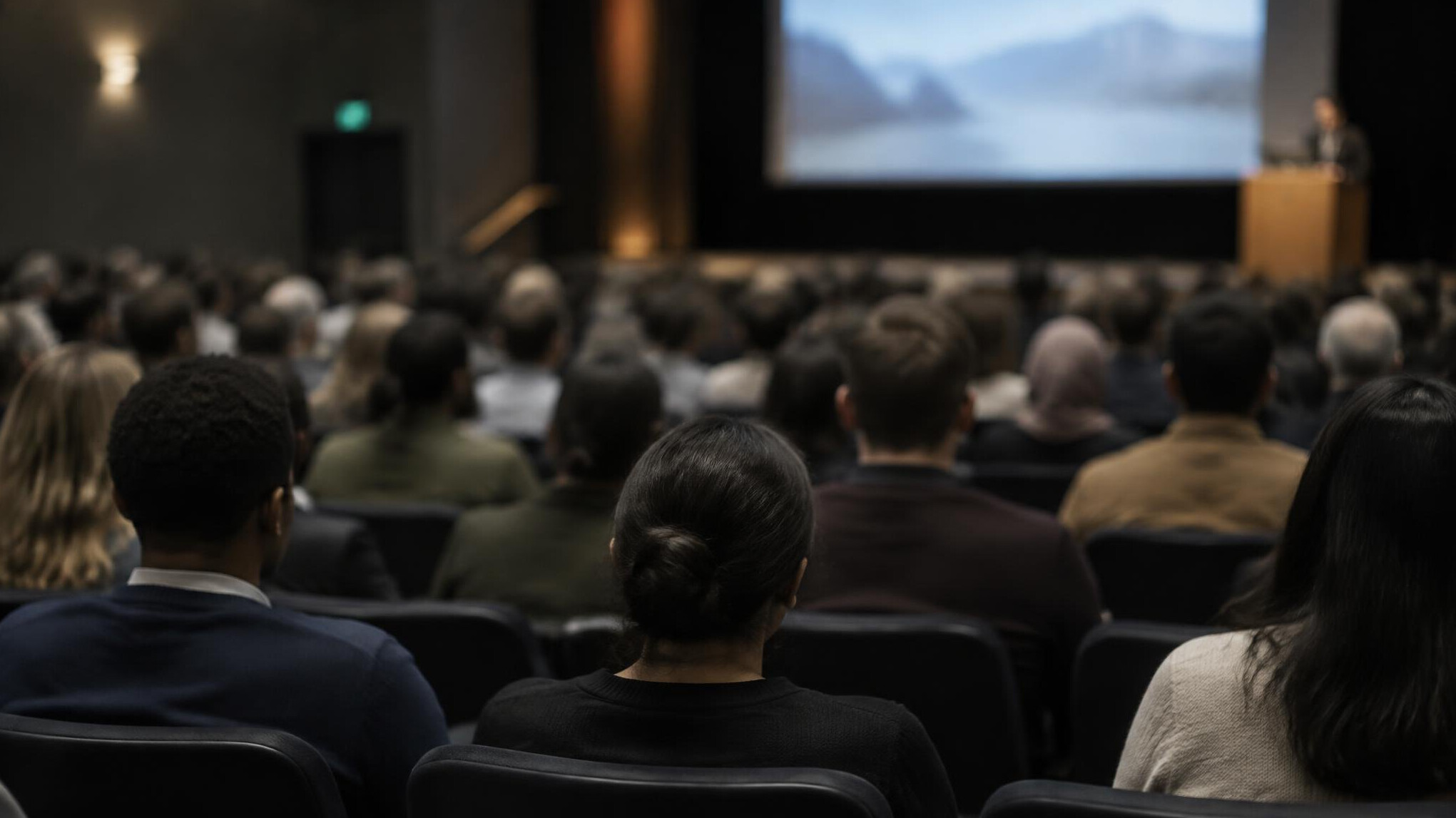 Blurred audience seated in a conference hall