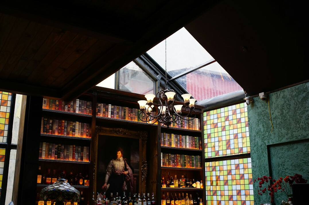Classic library reading room with warm lamps