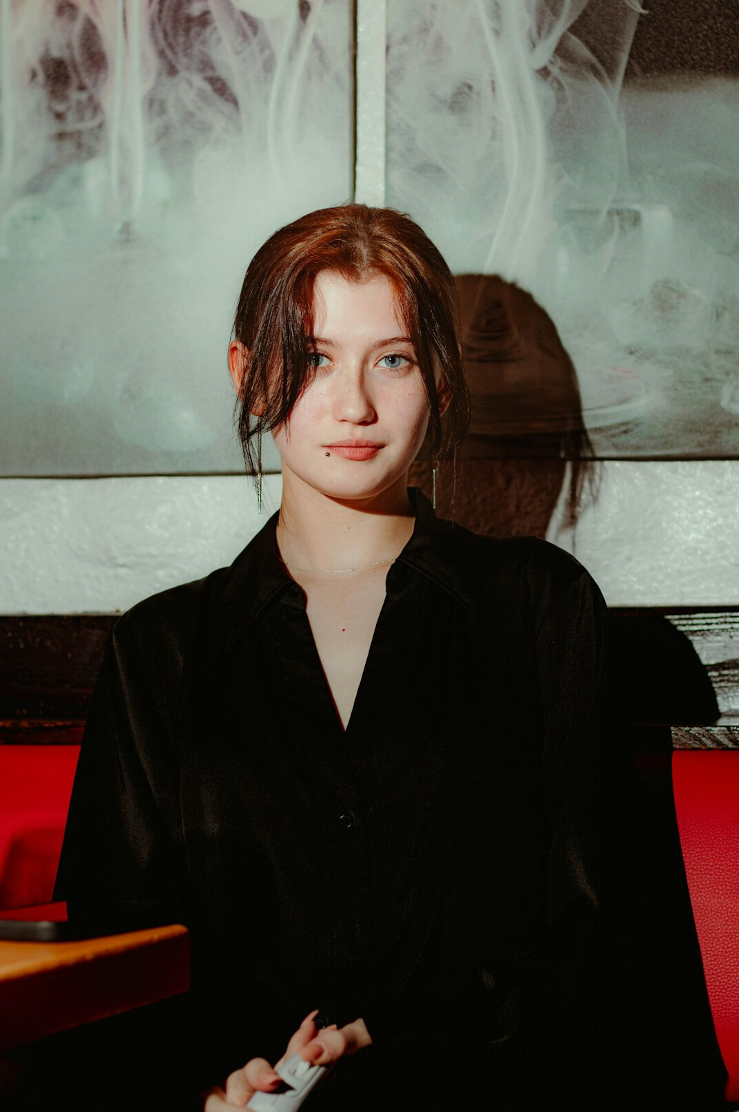 Portrait of a woman researcher with shoulder-length hair in a dark blazer